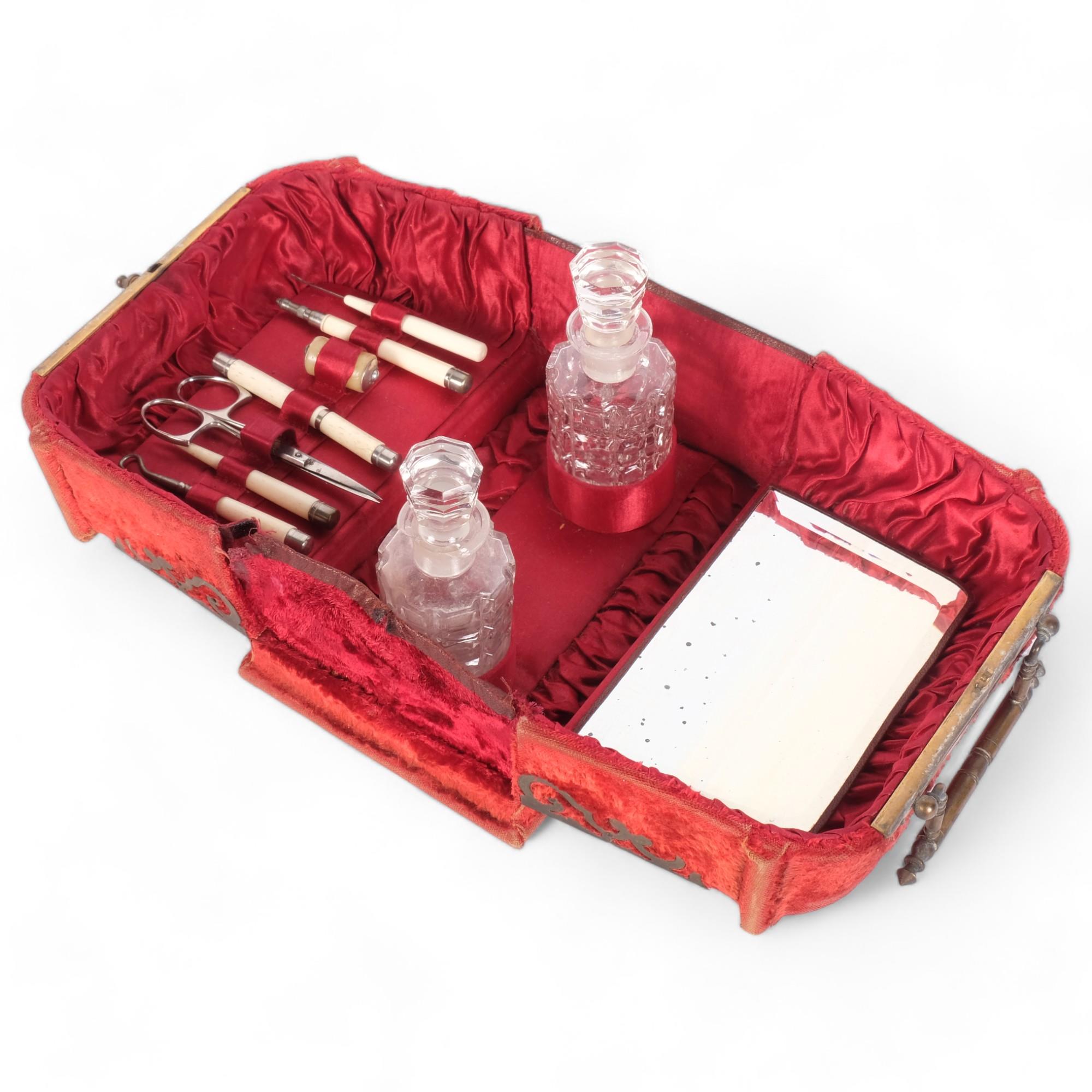 An Antique velvet-covered travelling vanity/sewing box, the interior fitted with 2 glass scent