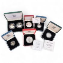 A collection of silver proof coins, including 1996 and 1999 one pound coins, a 1997 silver proof 50p