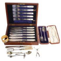 A cased fish cutlery set for 6 people, with mother-of-pearl handles and engraved blades, with silver