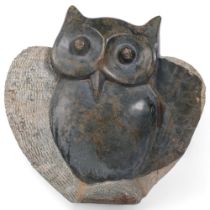 A hand carved stone sculpture of an owl, H40cm