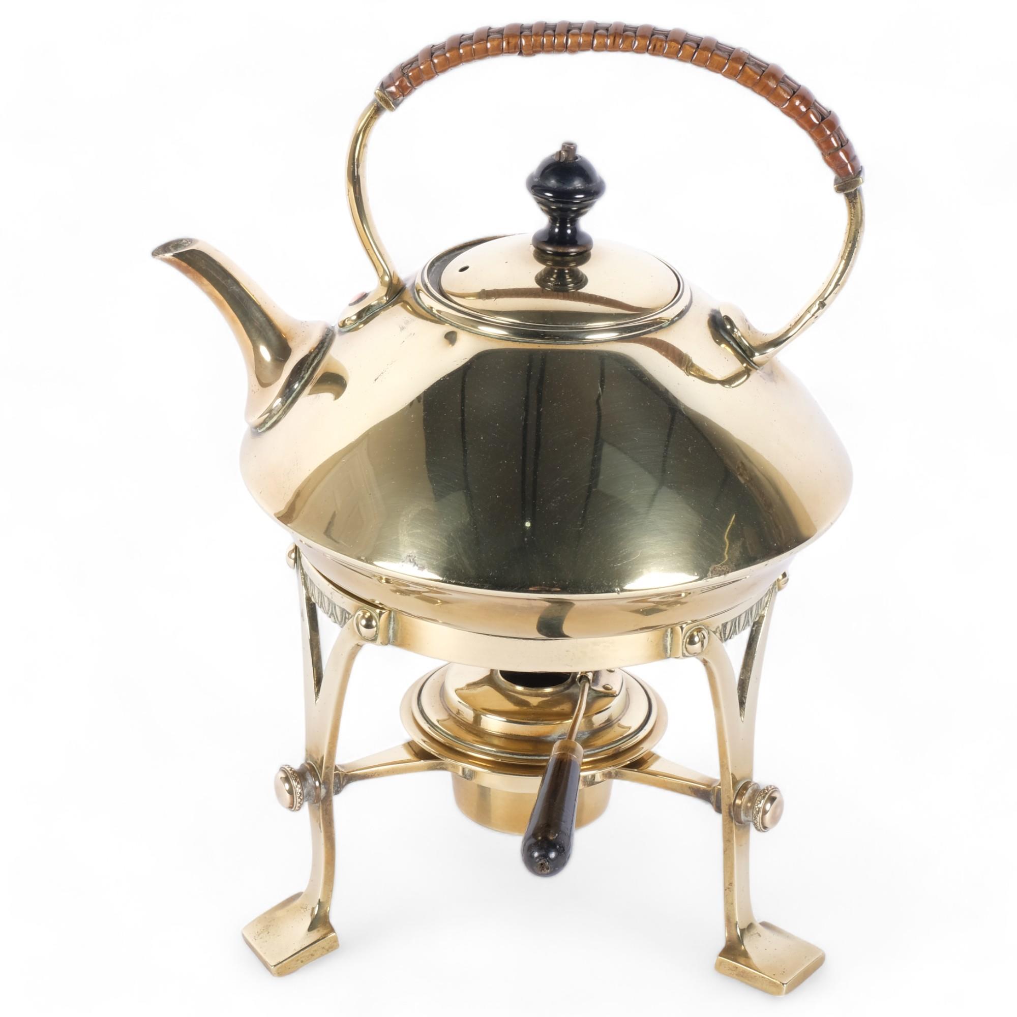 A 19th century Aesthetic Movement brass spirit kettle, in the manner of Christopher Dresser, H28cm