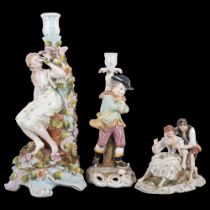 A German porcelain candlestick, supported by a girl smelling a flower, H35cm, a candlestick
