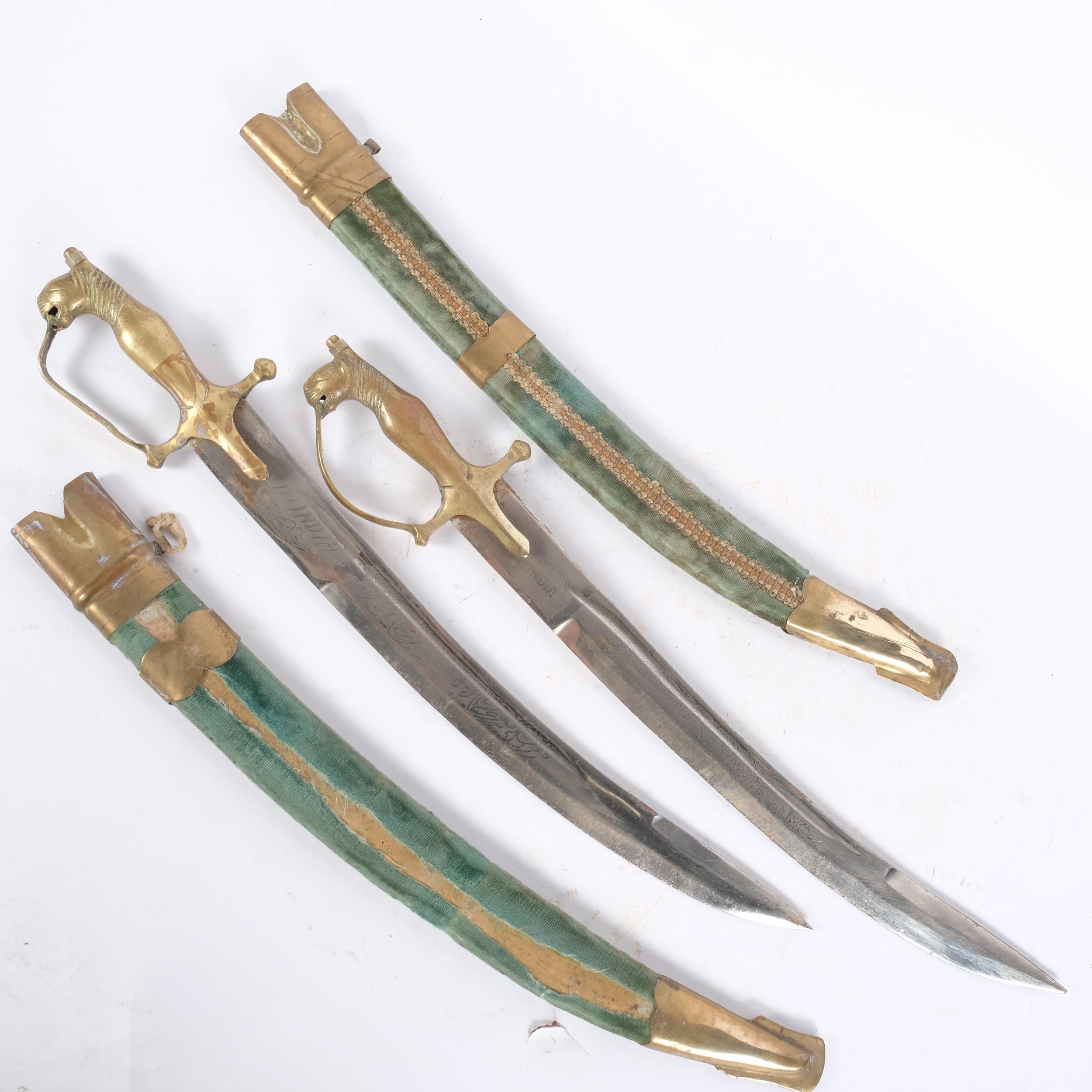 A pair of Indian brass-mounted short swords, engraved blades and velvet-covered scabbards, blade - Image 2 of 2