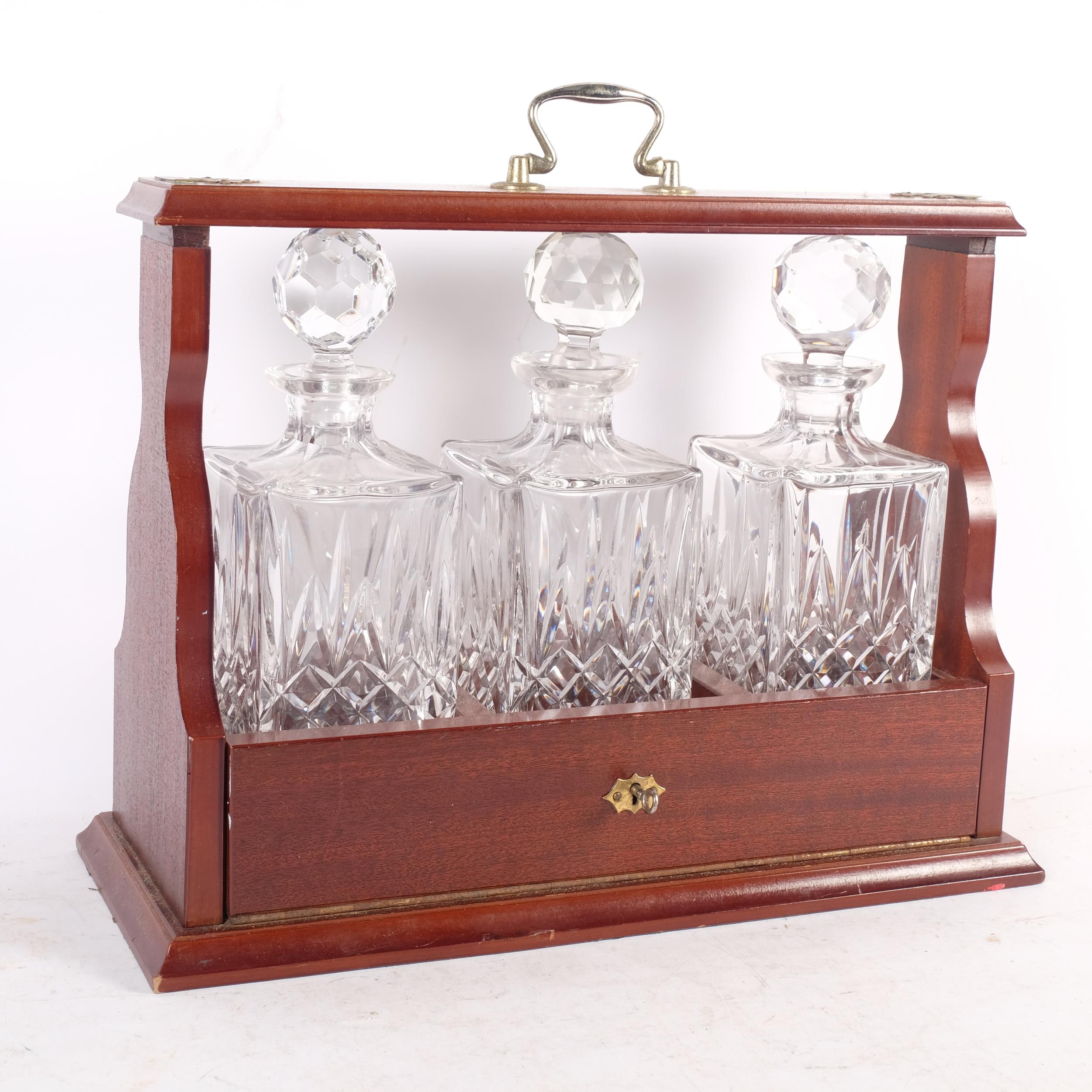 A mahogany 3-bottle tantalus, with crystal decanters, W43cm - Image 2 of 2