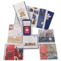 A collection of silver commemorative coins, including a twenty pound Outbreak of the First World War