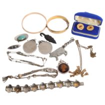 A group of various jewellery, including a Finnish gilt-metal pendant and chain, an African
