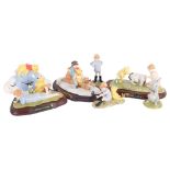 A group of Royal Doulton Christopher Robin Winnie The Pooh figures, including Going Sledging on