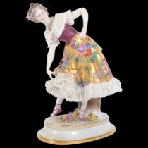 A Continental porcelain figure group, a lady in a crinoline dress, H19cm