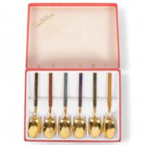 A set of Meka, Danish, gilded spoons, with hand enamelled decoration, original box
