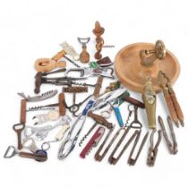 Antique and other corkscrews, a nut dish, nutcrackers, and bottle openers
