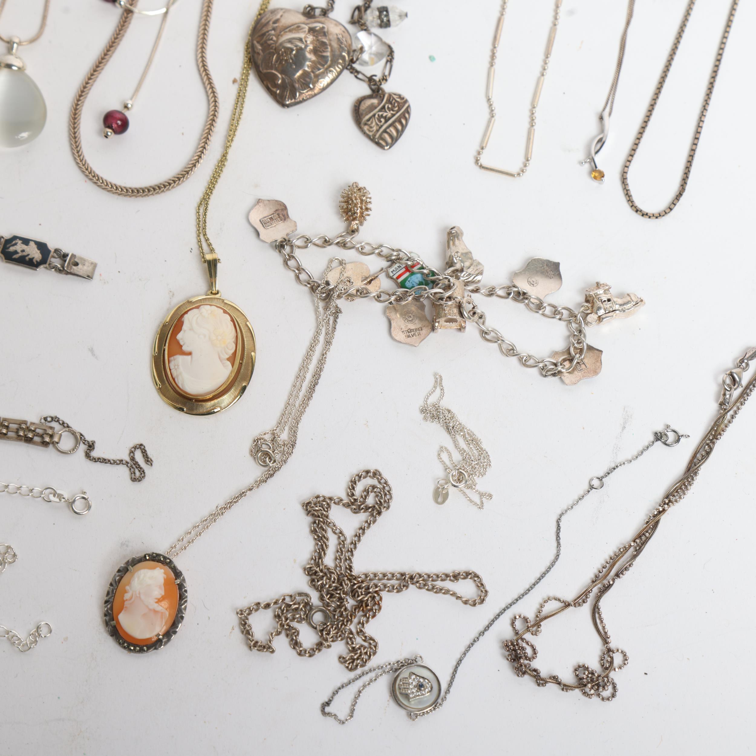 A collection of silver and other chains, pendants, etc, including a silver and niello panelled - Image 2 of 2