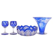 A blue overlay glass vase with grapevine design, H17.5cm, a blue overlay cut-crystal bowl, and