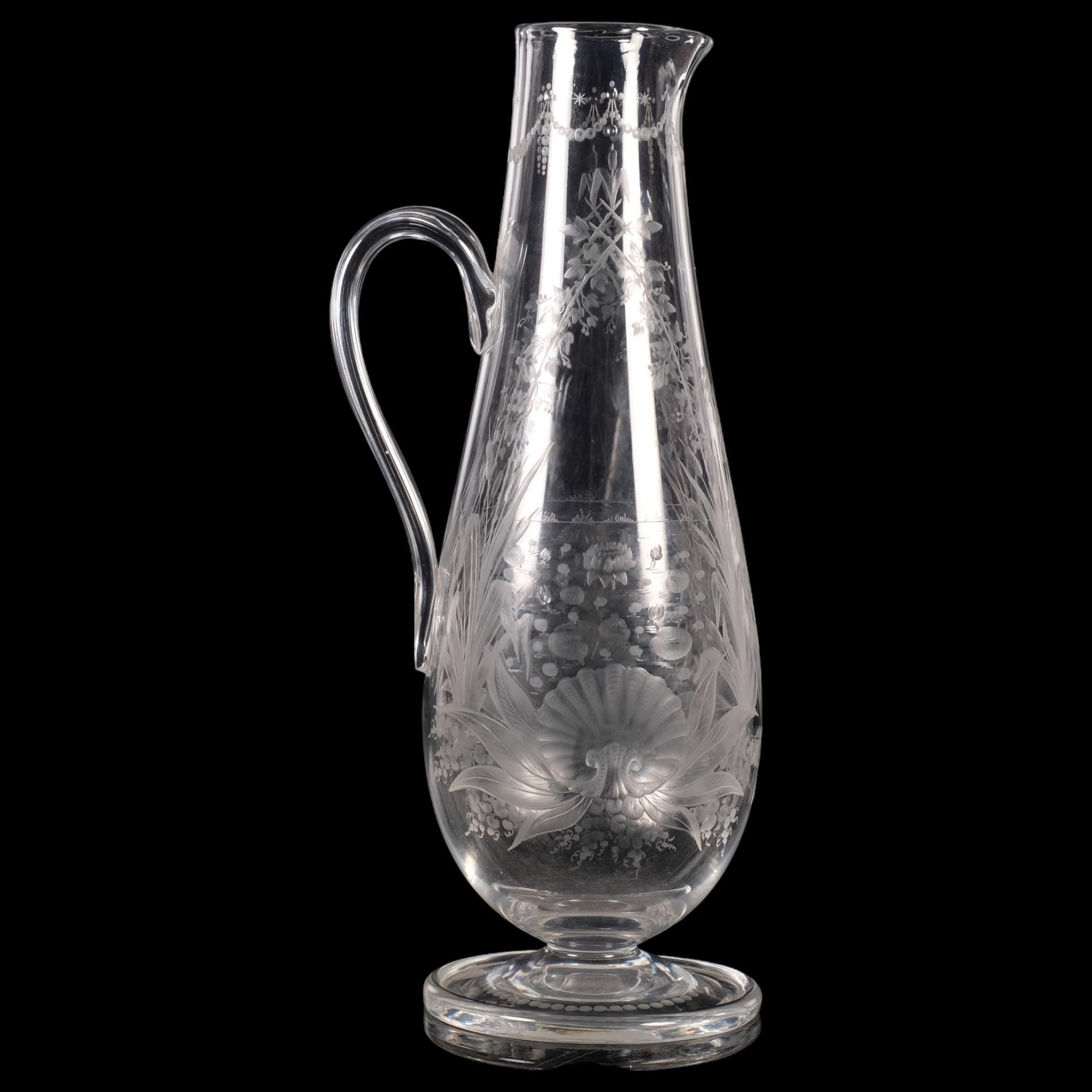 An Antique Stourbridge etched glass Claret jug, with floral decoration, on turned foot, H30.5cm