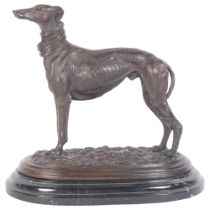 A bronze sculpture of a Greyhound, on oval marble plinth, H29cm