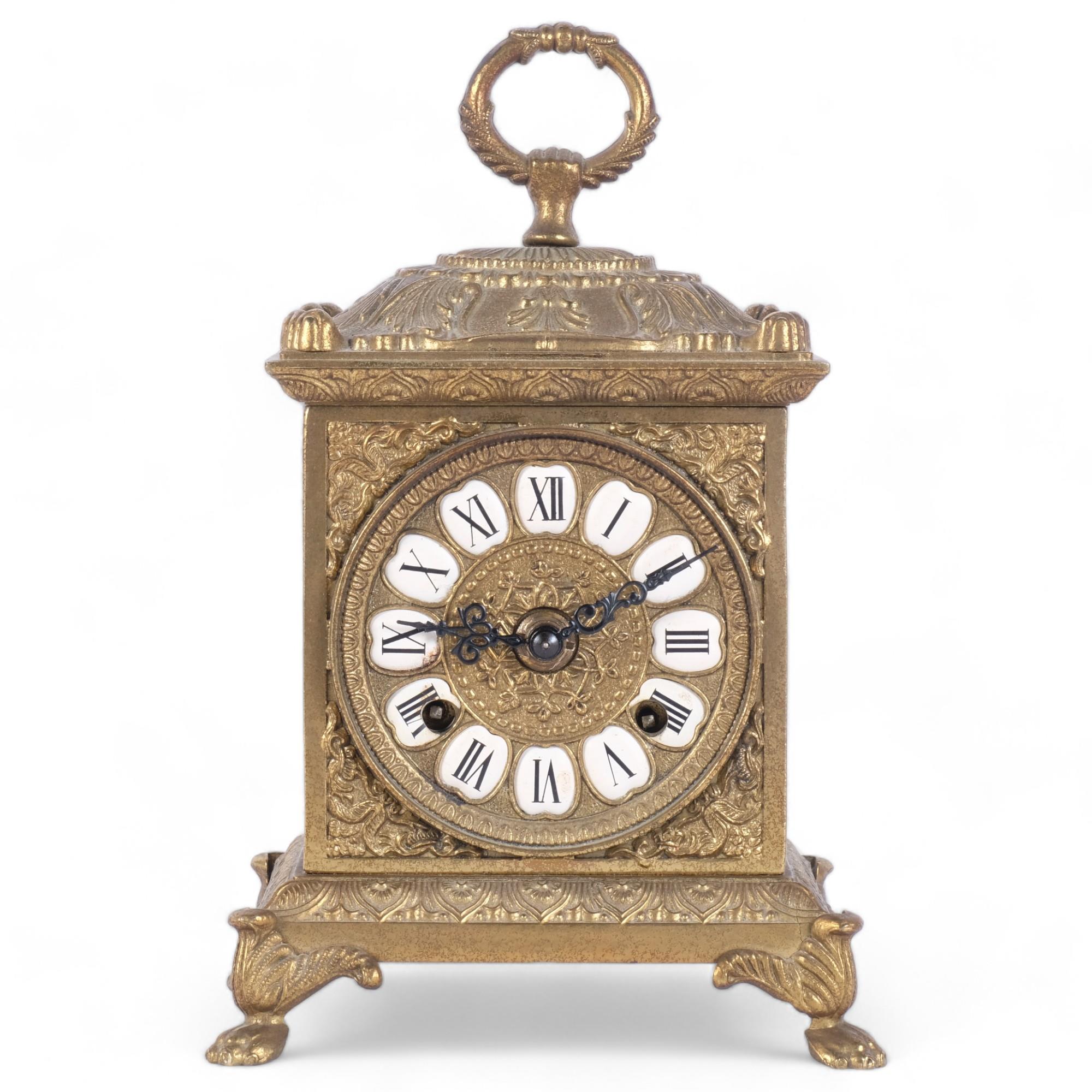 A small gilt-metal mantel clock, 8-day striking movement, enamelled batons and Roman numerals,