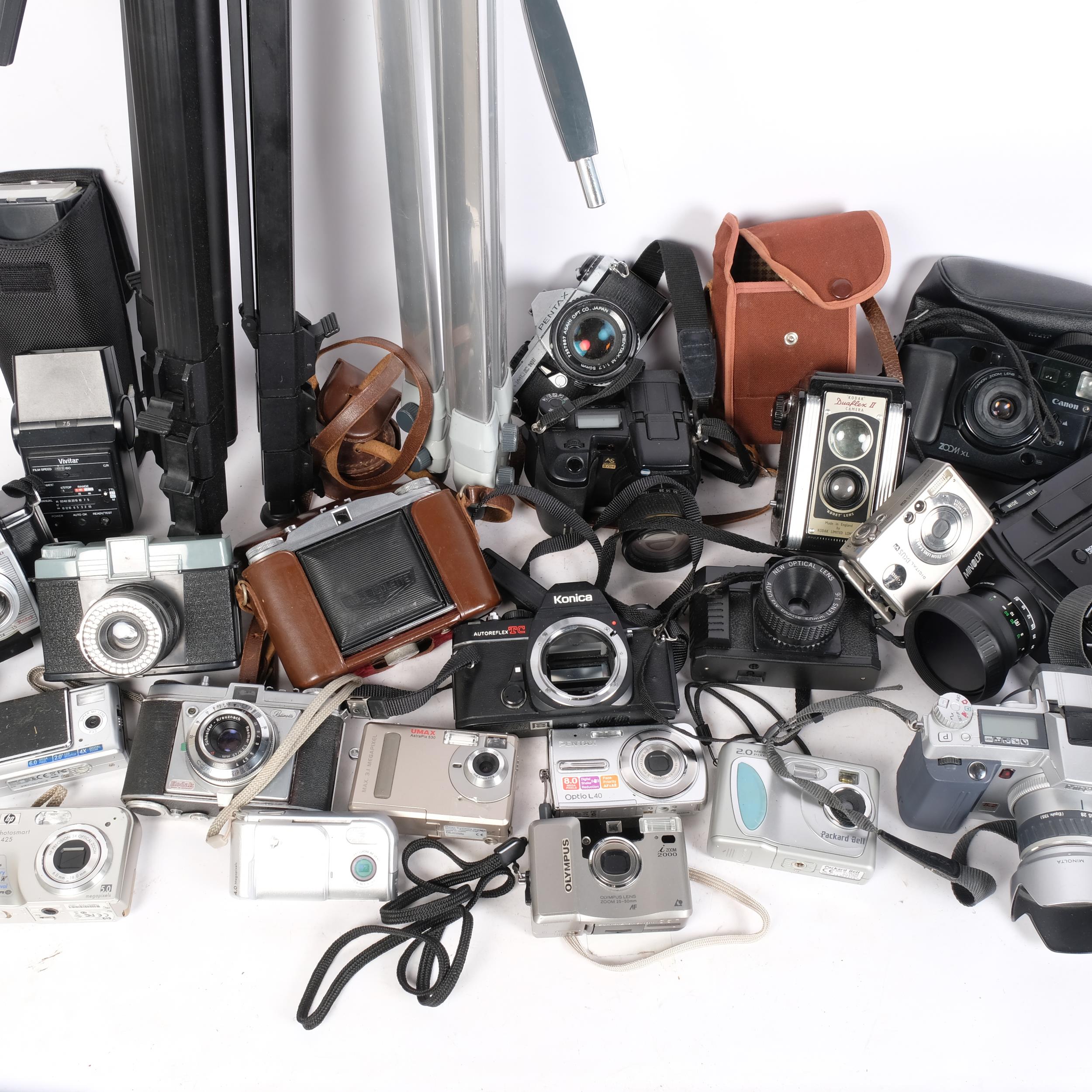 A quantity of Vintage cameras and associated accessories, including a Canon digital IXUSV2, a - Image 2 of 2