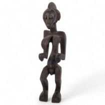 An African carved Tribal hardwood fertility figure, H48cm