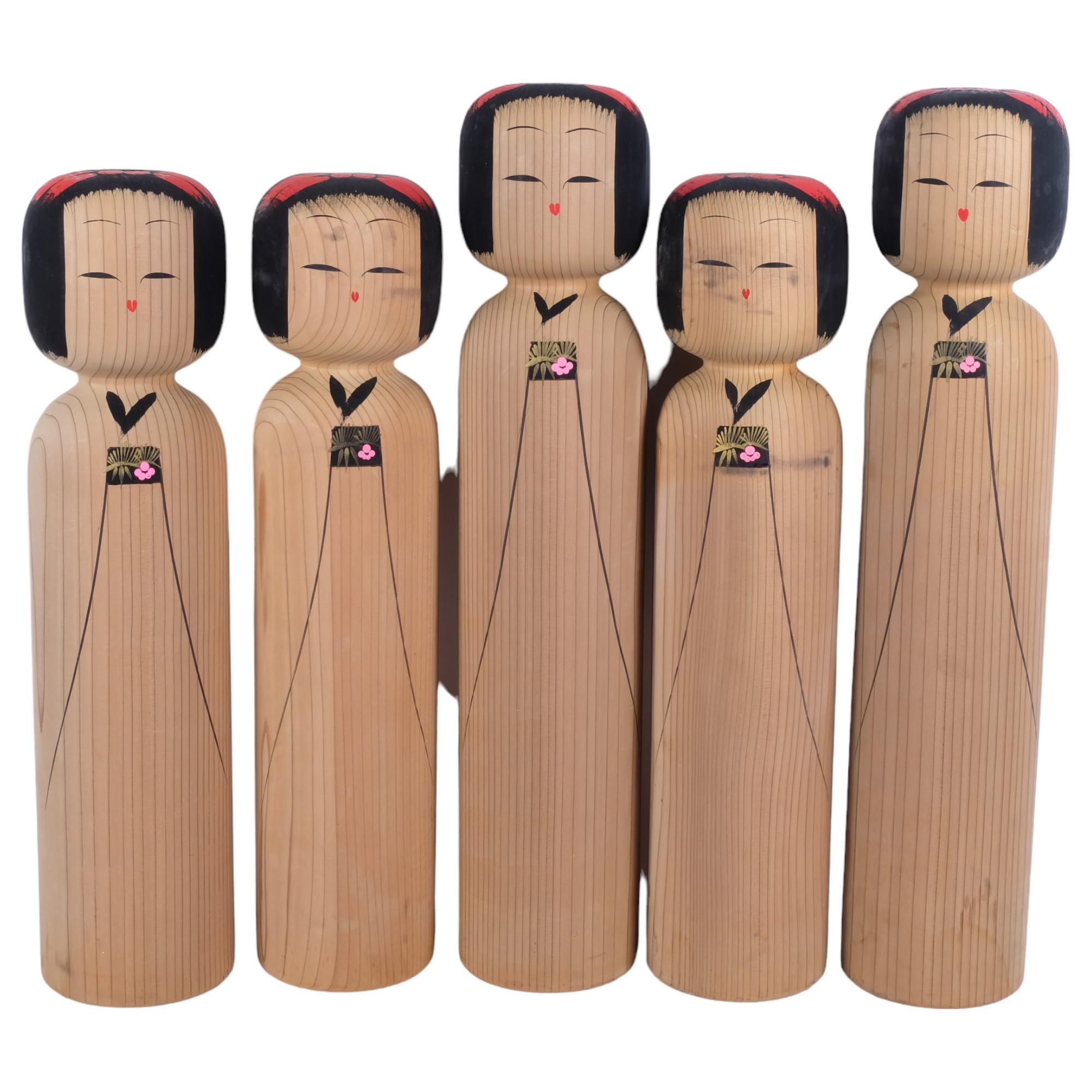 A group of 5 large Kokeshi dolls, various sizes, largest height 55cm