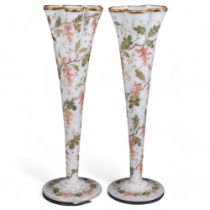 A pair of Edwardian painted and gilded milk glass vases, with wisteria design, 34cm
