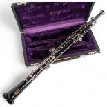 A Boosey & Hawkes oboe, serial no. 496971, in associated fitted hardshell casing