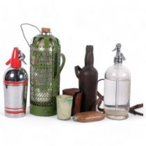 A glass soda syphon advertising Victoria Wine, 31cm, another, 3 Bandalasta beakers in leather