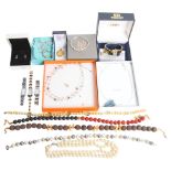 Various boxes of modern costume jewellery, including a lava and amber necklace, onyx and coral