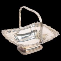A large silver plate on copper swing-handled fruit/bread basket, with acanthus leaf decoration,