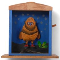 A scratch-built owl in a glass case, with handle operating closing eyes, H39cm