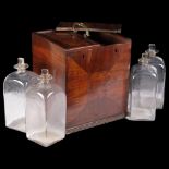 A large George III mahogany 4-bottle decanter box, with 2 sliding lids and brass carrying handle,