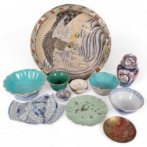 A group of Oriental items, including a large enamel charger, turquoise dishes, celadon dish, Imari