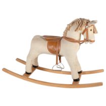 A corduroy child's rocking horse, lacking tail, by Elf Toys, rocker length 92cm