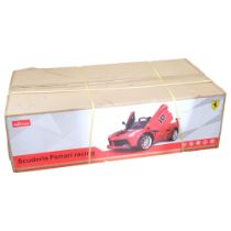 A child's battery operated ride-on Scuderia Ferrari racing car in red, new and unboxed