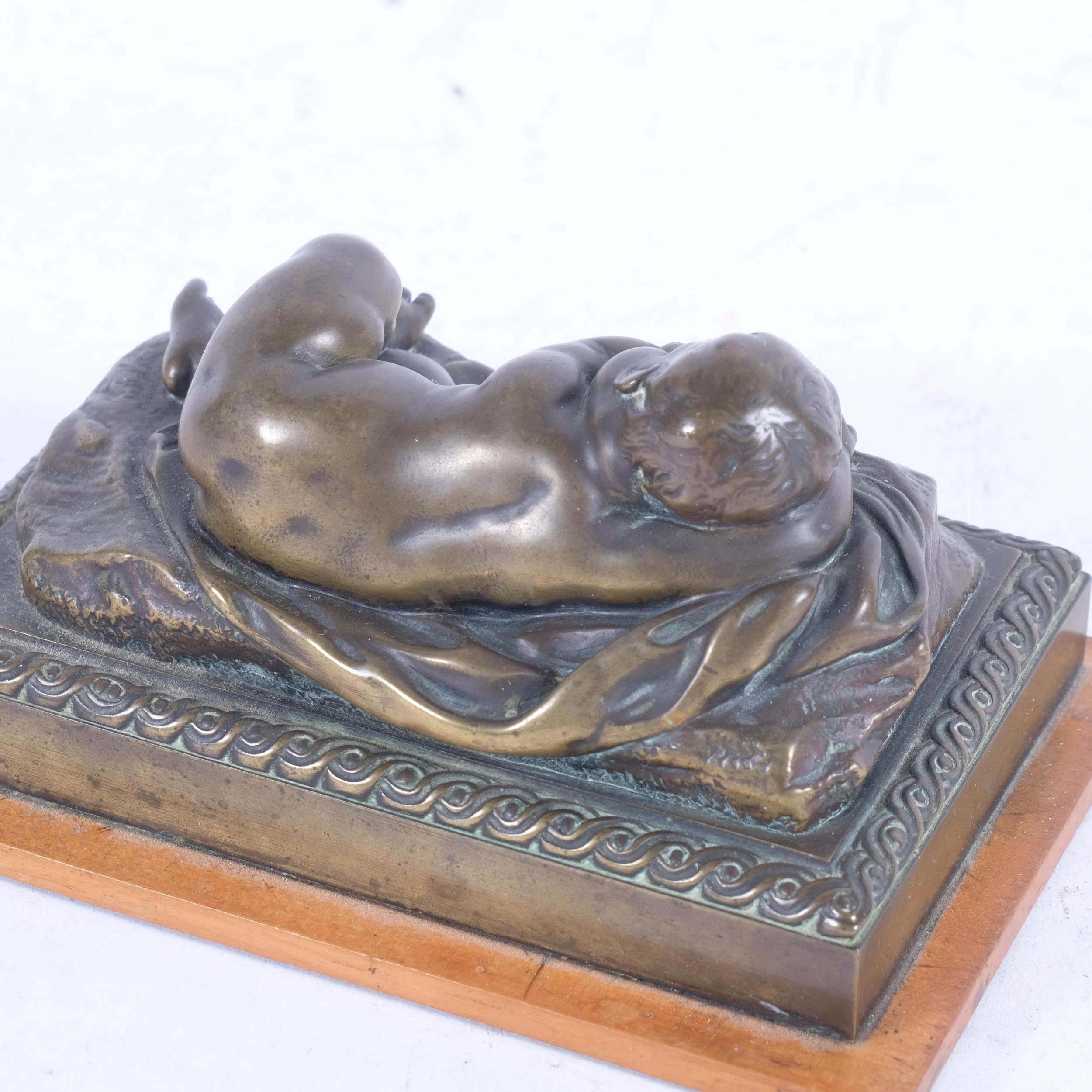 A patinated cast-bronze study of a sleeping child, overall length 15.5cm - Image 2 of 2