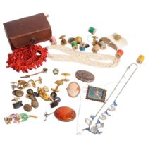 A group of various costume jewellery, including a coral bracelet, a relief carved cameo, various