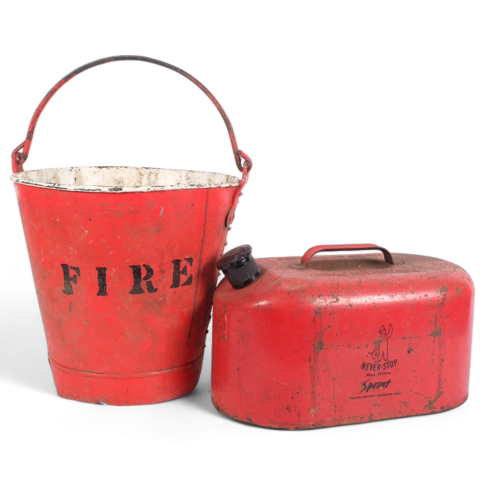 An old fire bucket, and a Never-Stop 10 litre petrol can