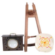 A mahogany cello stand, 53cm, A Vallauris Capron painted plate, and an Art Nouveau metal-cased lens