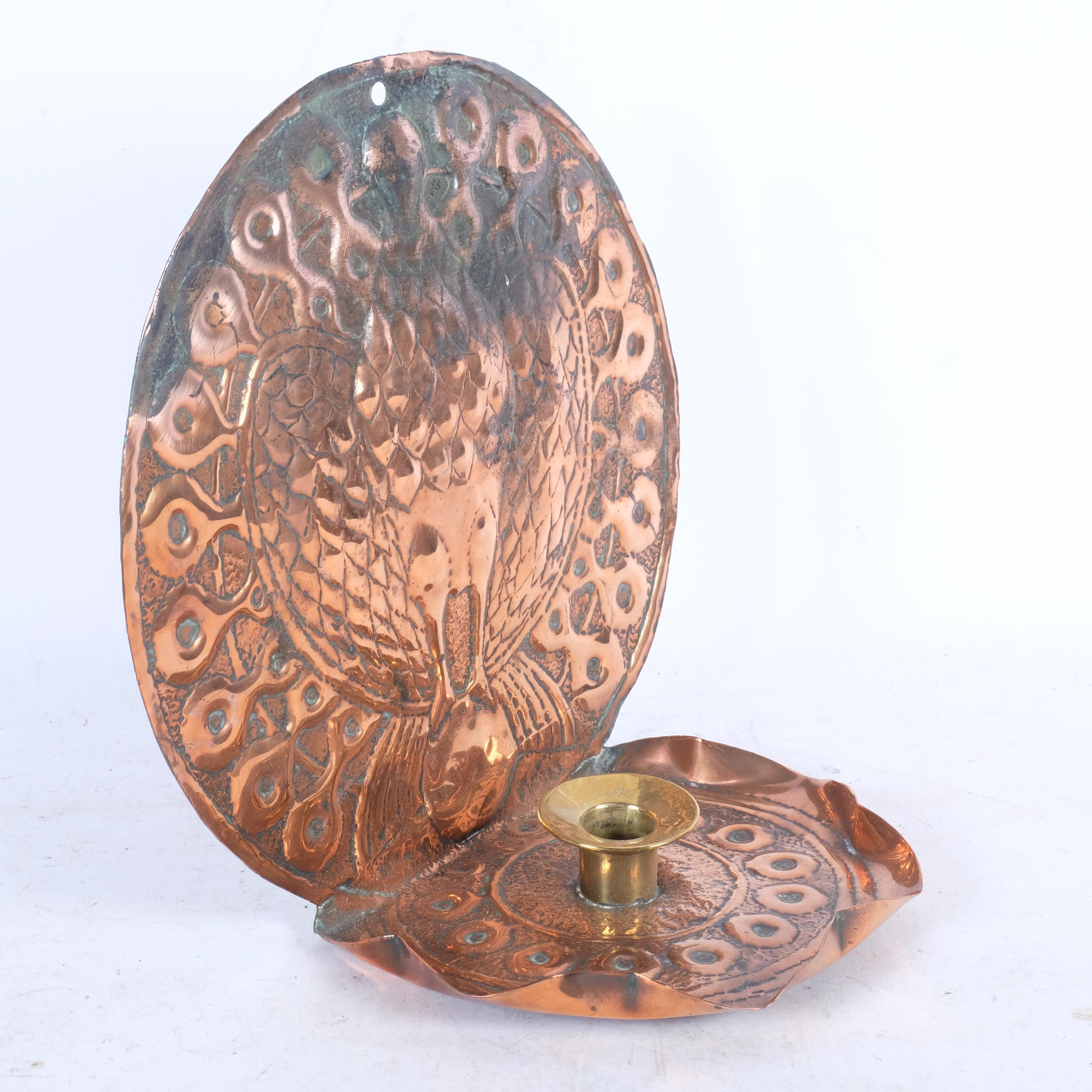An Arts and Crafts copper and brass chamber stick, with stylised peacock design, H24cm - Image 2 of 2