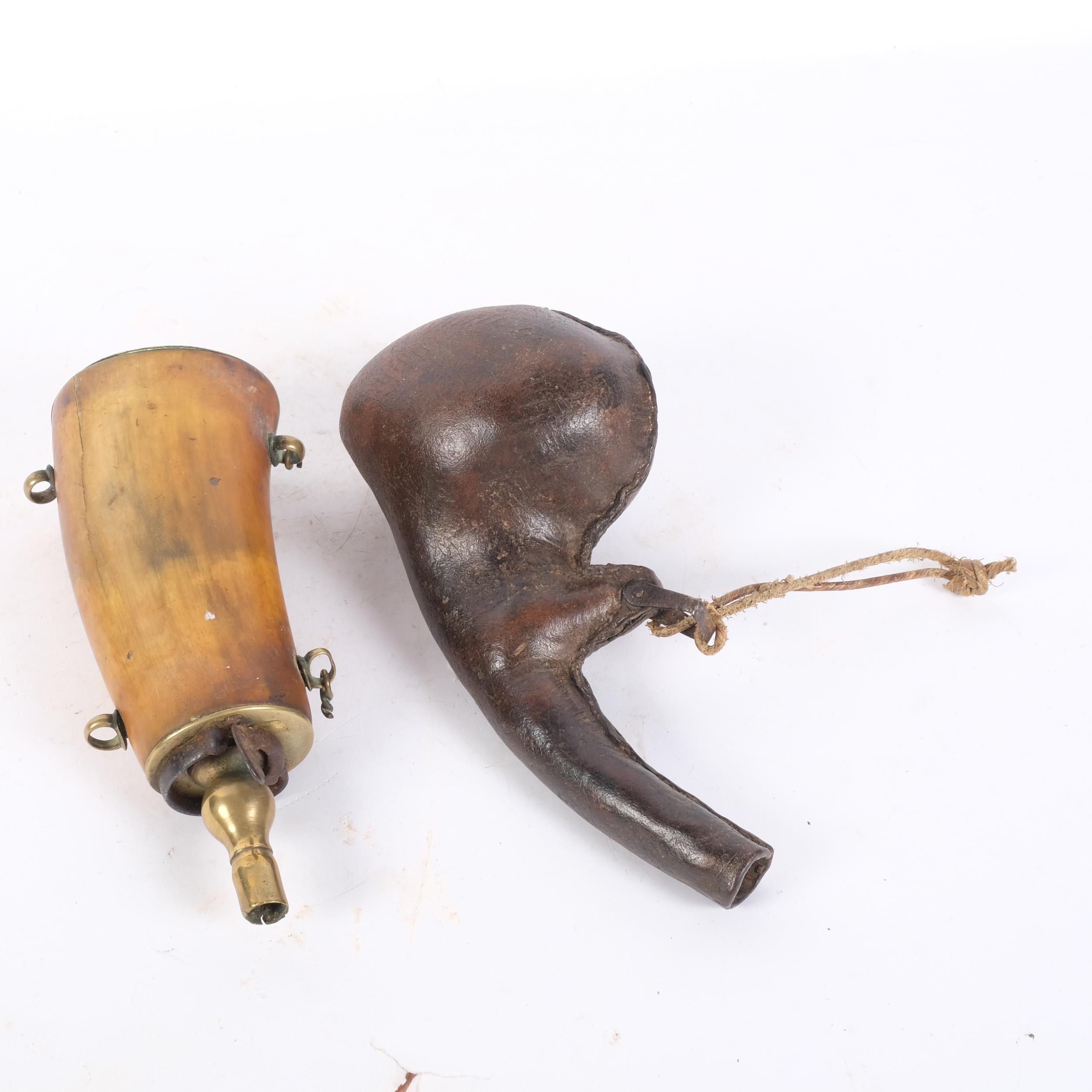 An Antique buffalo horn powder flask with brass mounts, and a pressed stitch leather shot flask - Image 2 of 2