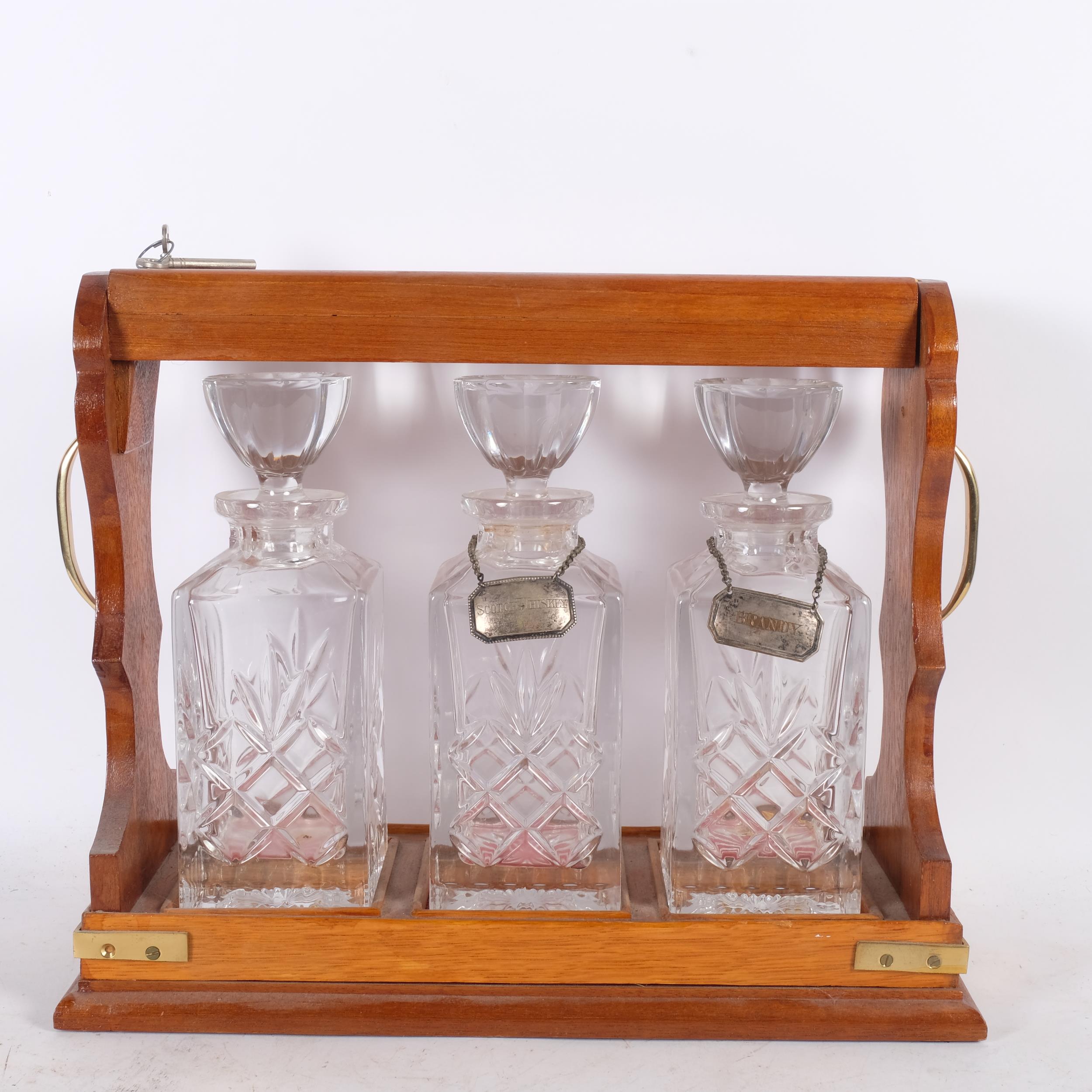 An oak 3-bottle tantalus, with crystal decanters, and 2 silver plated labels, L41cm - Image 2 of 2