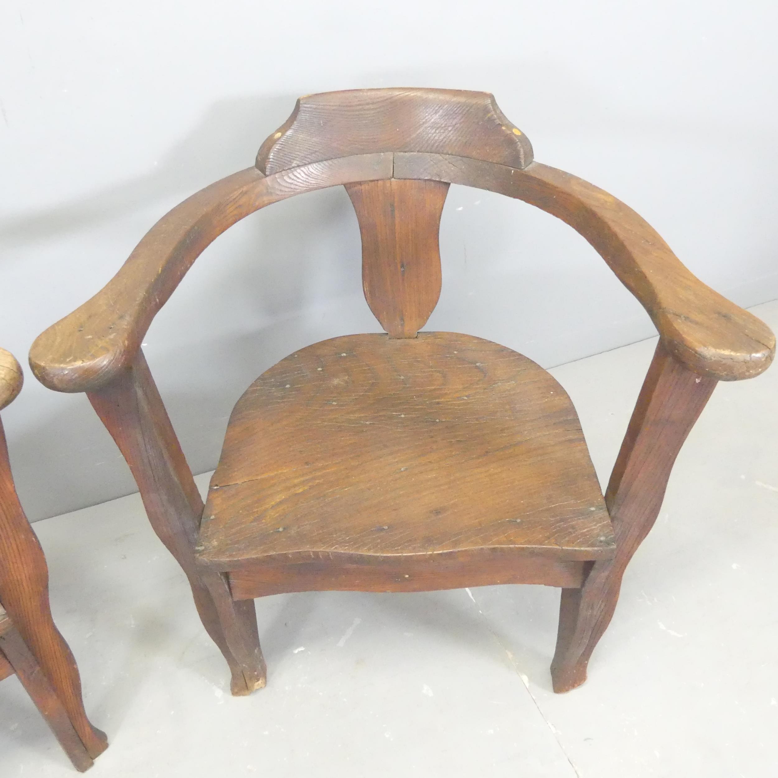 A pair of oak and pine bow-arm captain's chairs. - Image 2 of 2