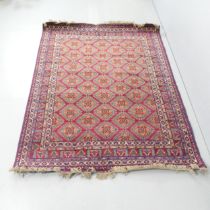 A red-ground Turkomen rug. 195x150cm.