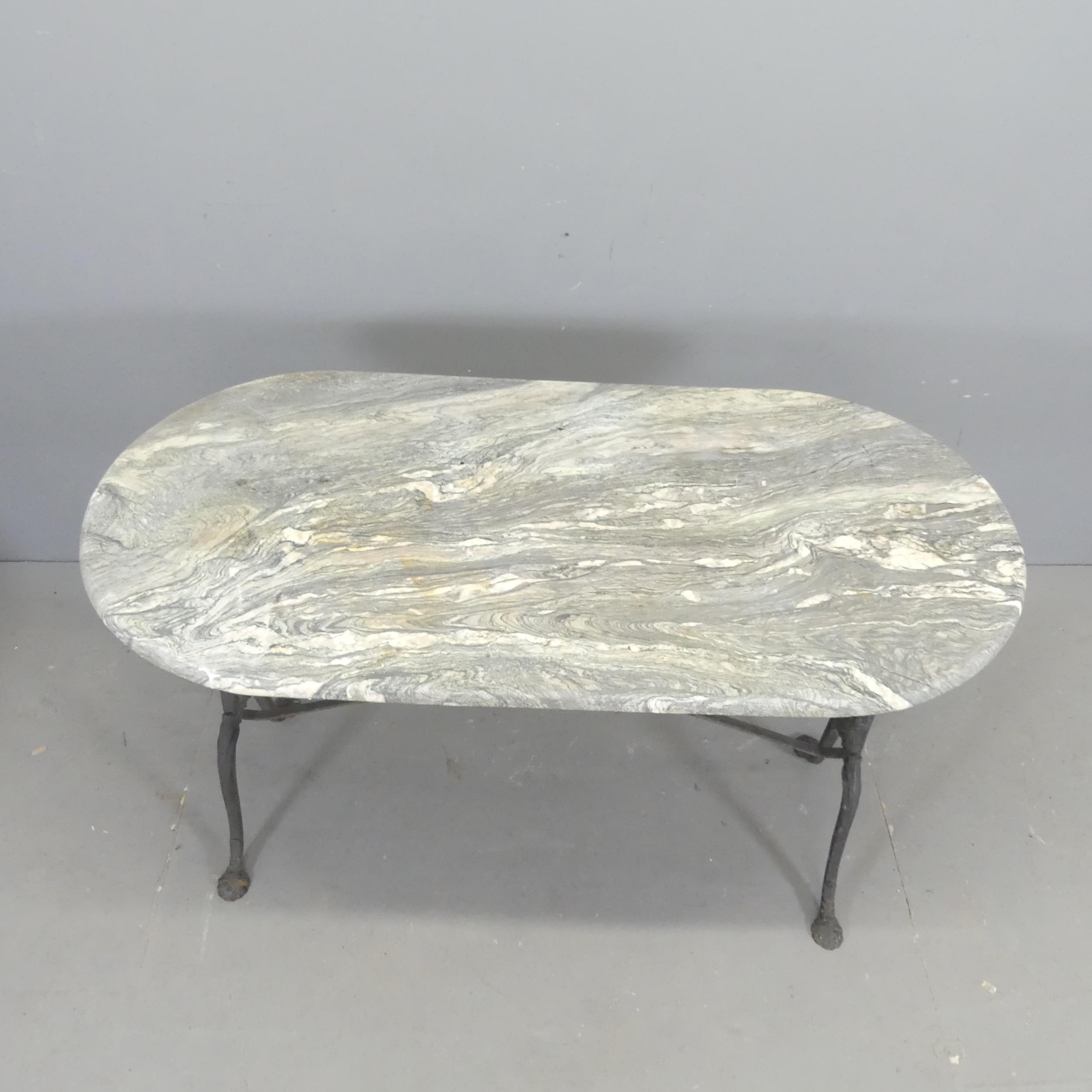 An oval marble-topped garden table on cast-iron frame. 129x72x60cm. - Image 2 of 2