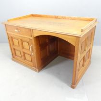 An early 20th century pitch pine kneehole desk. Overall 136x78x73cm, kneehole 56x60cm.