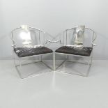 A pair of contemporary designer Ming style armchairs in polished steel with ponyskin seats.