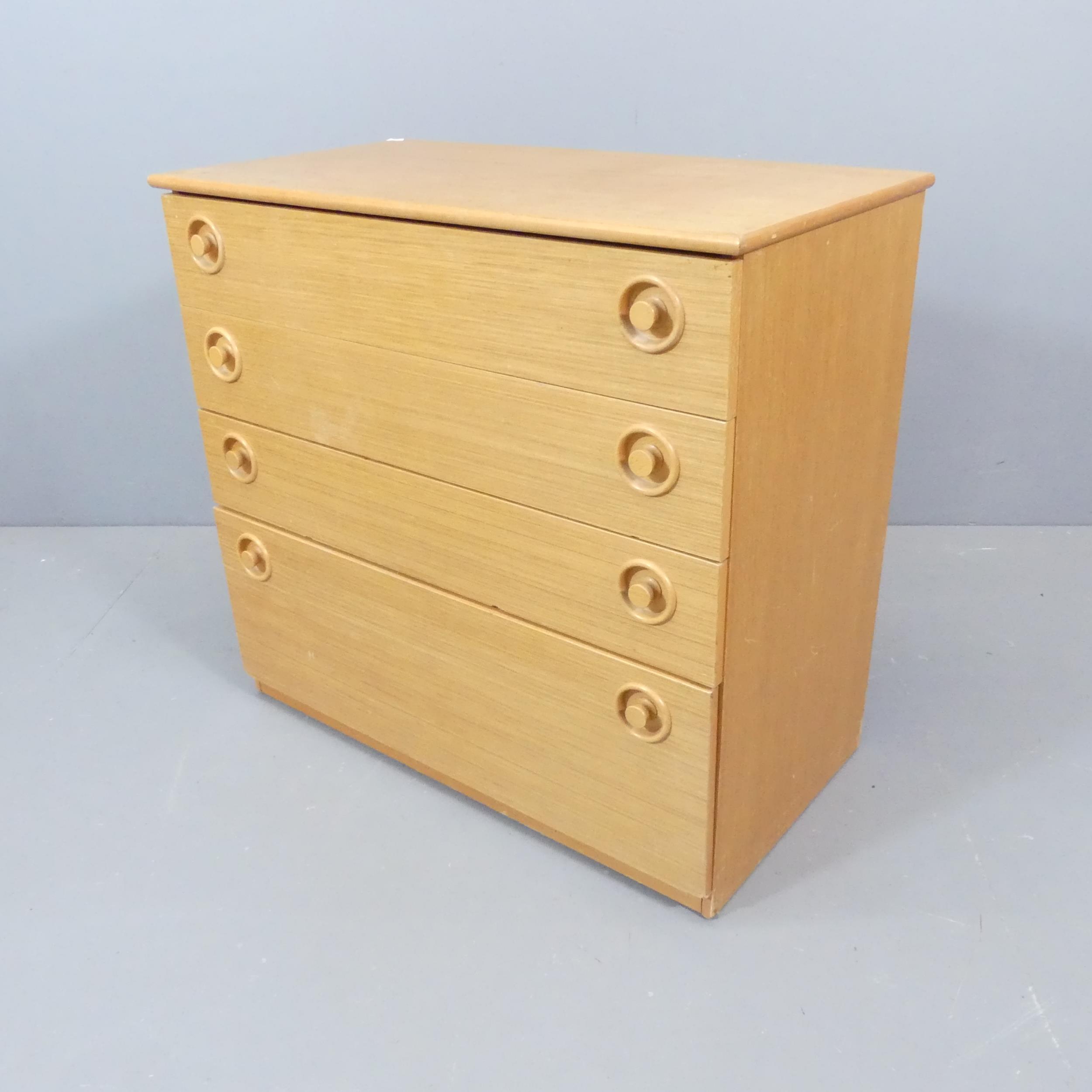 SHREIBER - A mid century blonde teak chest of drawers. No maker's marks. 75x70x40cm.