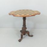 A Victorian mahogany tilt-top occasional table, with walnut veneered top inlaid with satinwood and