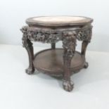 Chinese circular carved hardwood 2-tier table, with inset marble top in carved lobed surround,