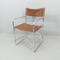 A mid-century design folding armchair in the manner of Gae Aulenti.