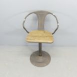 A vintage industrial swivel chair.