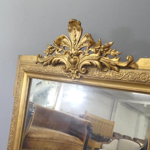 A modern continental style gilt-painted wall mirror with carved decoration. 69x112cm. - Image 2 of 2